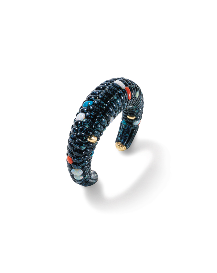 Blue corn bracelet by Lee Yazzie is constructed with hidden bracework that anchors the turquoise, opal, lapis and coral gemstone kernels.