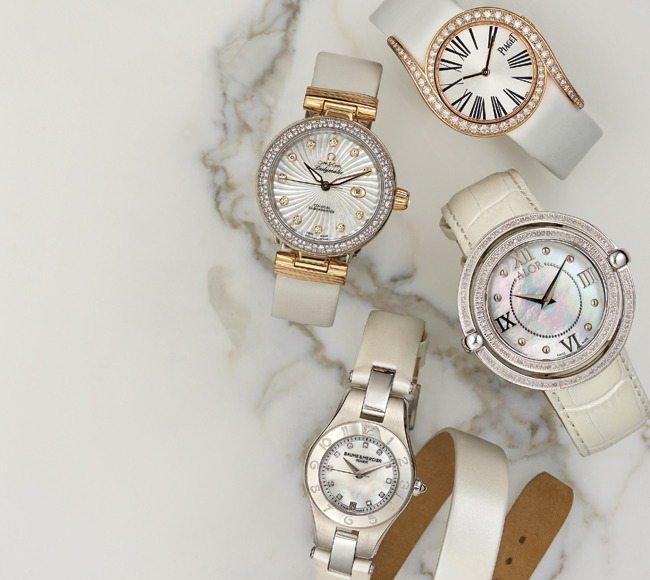 Piaget Limelight Gala watch ($34,000);  Omega Ladymatic watch ($20,200); Alor 1979 Swiss watch ($2,495); Baume & Mercier Linea watch ($2,990) with interchangeable strap. Photo by Jeff Crawford, Niche Media.